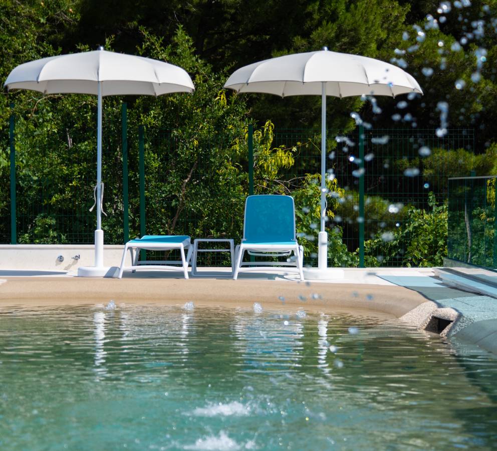 Pool sun beds and parasols